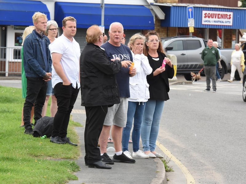 The community blew bubbles as the funeral cortege passed by because DJ loved bubbles.