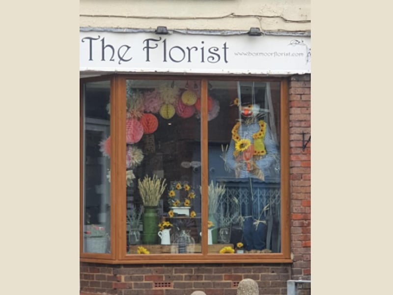 The Florist in Boxmoor has displayed a scarecrow in the shop window