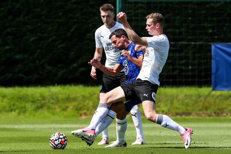 Josh Knight and Ethan Hamilton in action with Daniel Drinkwater of Chelsea.