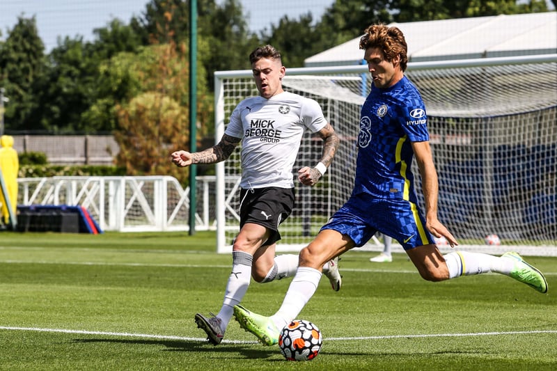 Sammie Szmodics in action with Marcos Alonso of Chelsea.