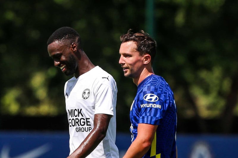 Mo Eisa shares a joke with Daniel Drinkwater of Chelsea.