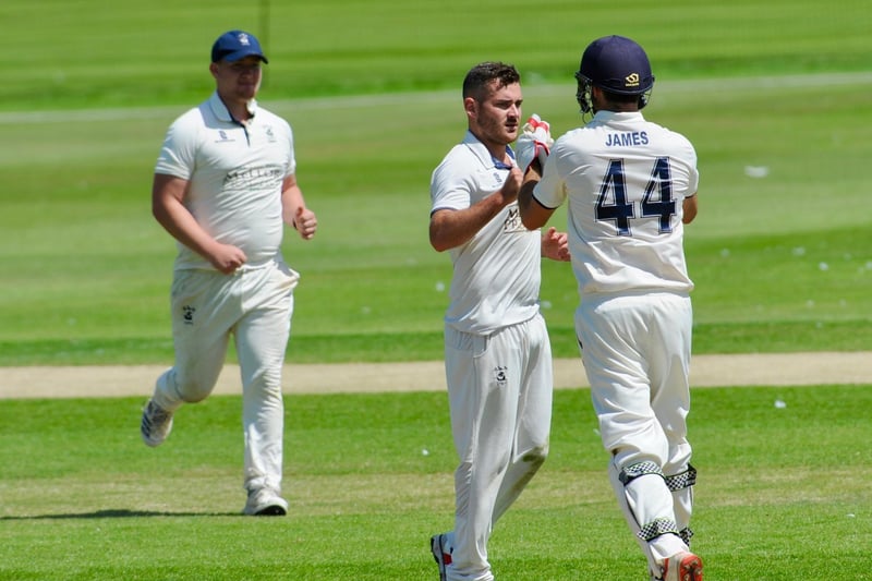 Macleod Cox celebrates the wicket of Jack Perman