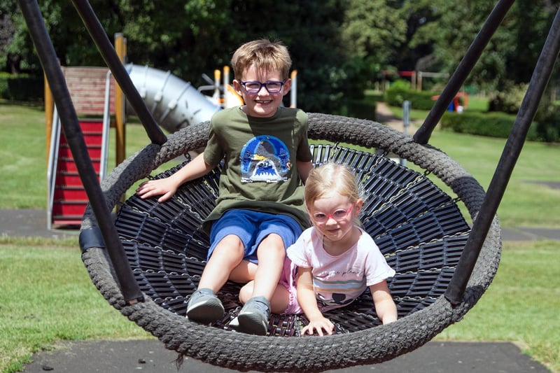 Not too hot to enjoy a swing for two at Abington Park