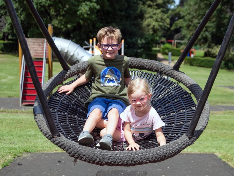 Not too hot to enjoy a swing for two at Abington Park