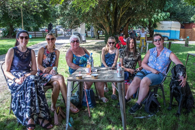 Ladies who lunch — plus a four-legged friend — enjoying the sun at Delapre Abbey