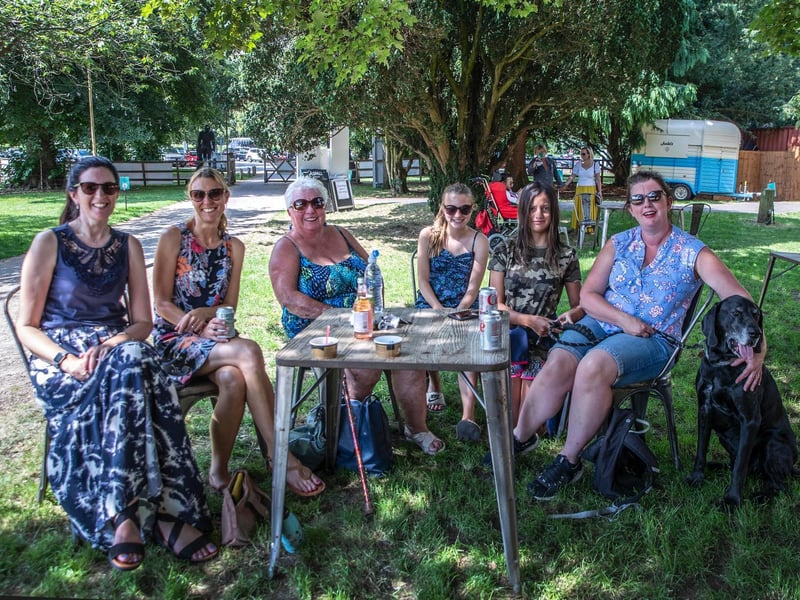 Ladies who lunch — plus a four-legged friend — enjoying the sun at Delapre Abbey
