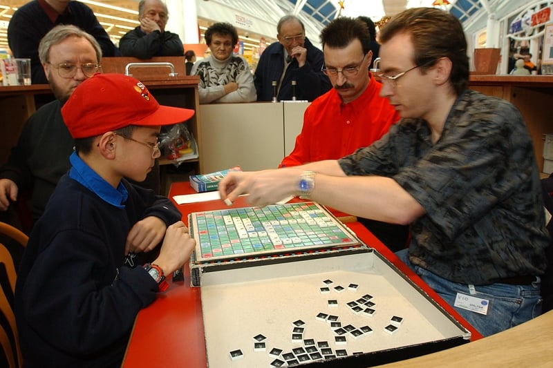 John Mansfield school maths teacher Chris Hawkins, 33, at Hampton shopping centre, setting a new 24hr world record for scrabble (total 135758), with help from his opponent Austin Shin, 12.