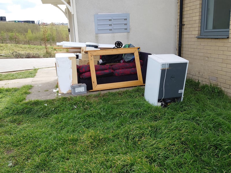 Fly-tipped rubbish in Four Chimneys Crescent.