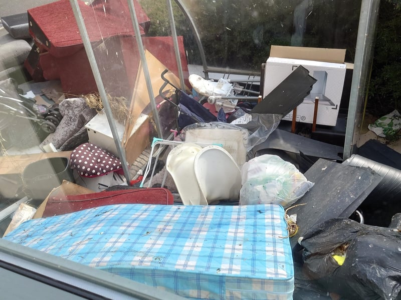 Rubbish behind the flats Peterfield Road reported in April.