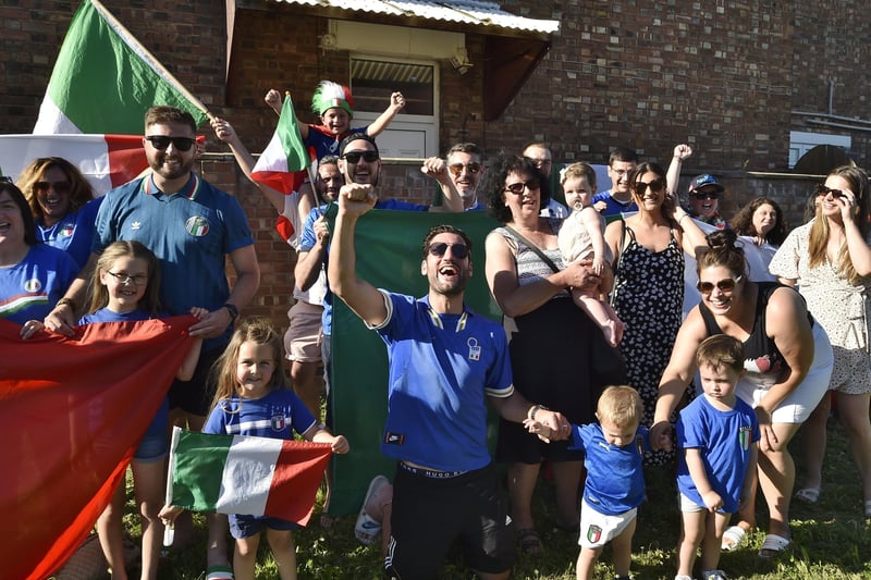 Former local boxer Marcello Renda with Italian fans celebrates the victory.