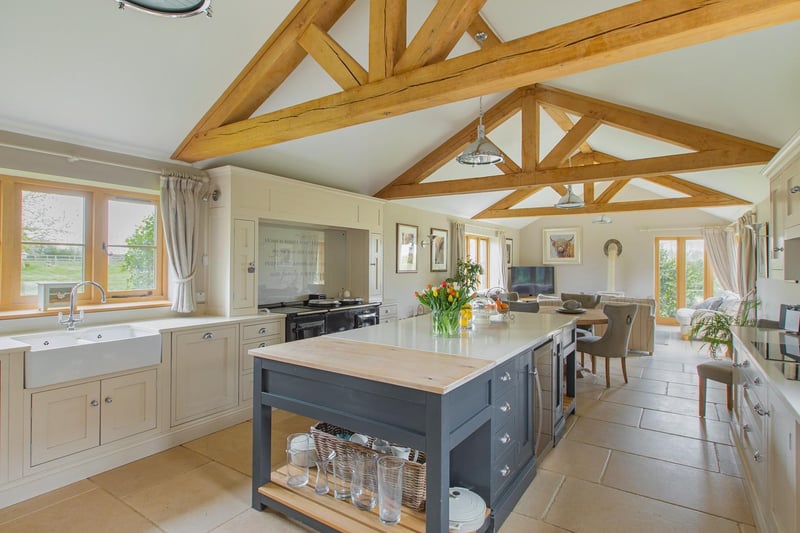 Of particular note is the exceptional AGA kitchen / breakfast room beyond the hall with a wide array of floor and wall mounted modern shaker style cabinetry, stone work surfaces and a large breakfast island.