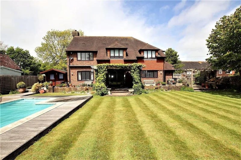 A four-bed detached family home on the market for £900,000.