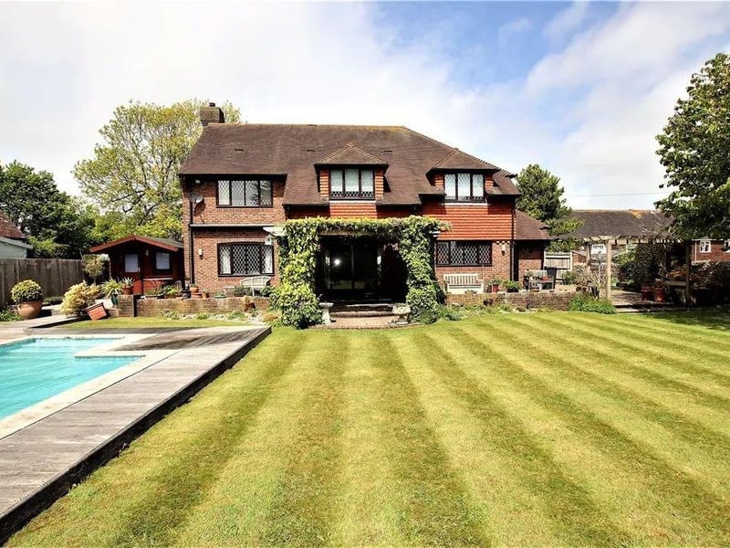 A four-bed detached family home on the market for £900,000.