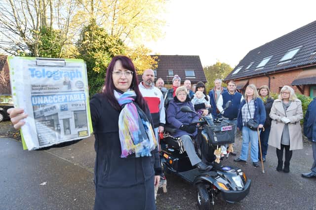 Jelana Stevic with a copy of a PT front page, in front of residents from St Michael's Gate and neighbouring areas