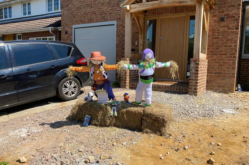 Sheriff Woody and Buzz Lightyear scarecrows