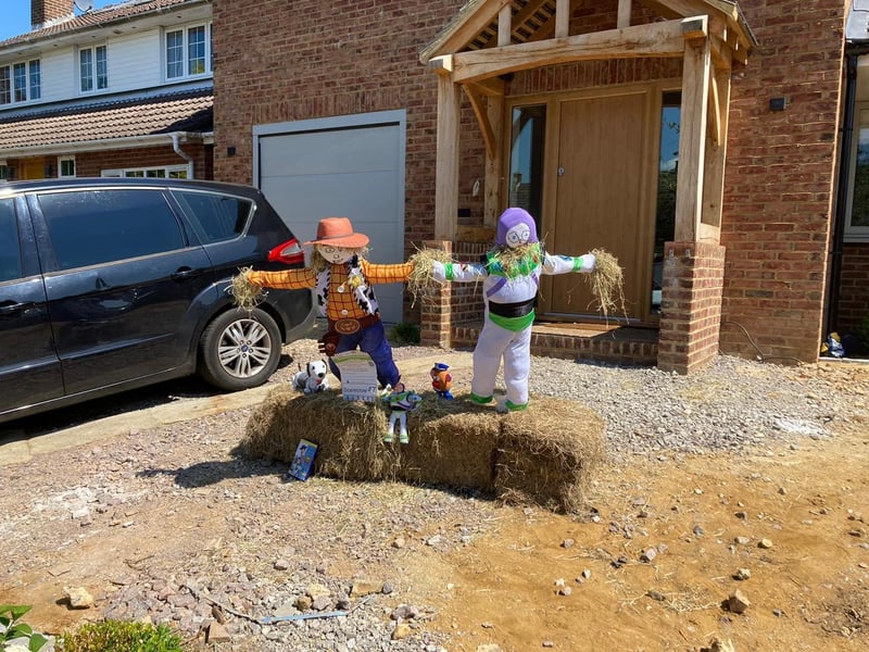 Sheriff Woody and Buzz Lightyear scarecrows