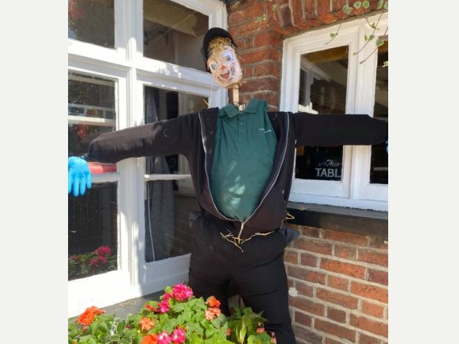 The Three Blackbirds pub displayed a scarecrow in the pub window
