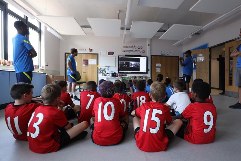 Dele chats with the young players from City Colts