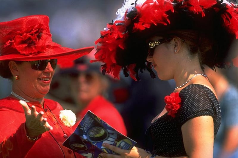 Two ladies admire each other's attire during the 1999 Glorious week / Picture: Phil Cole /Allsport