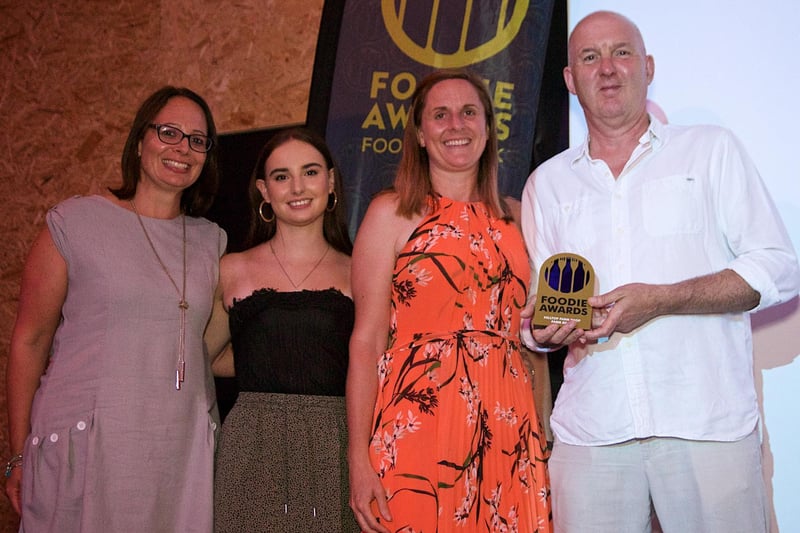 Valentine Smith of Comesto presents Hilltop Farm team with their Best Farm Shop award