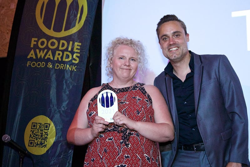 Courier and Weekly News editor Phil HIbble presents the Foodie Champion award to The Barn Kitchen.