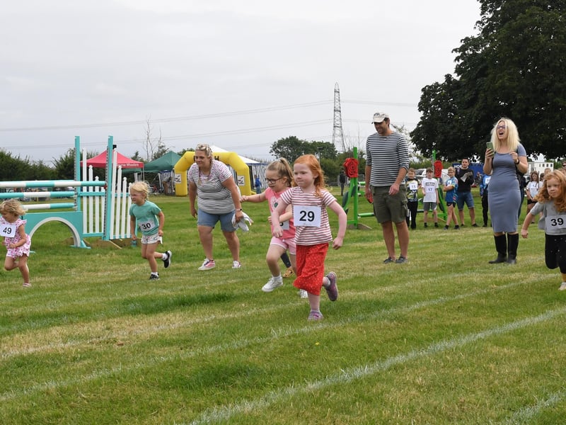 Children's races at Heckington Show. EMN-210726-122331001