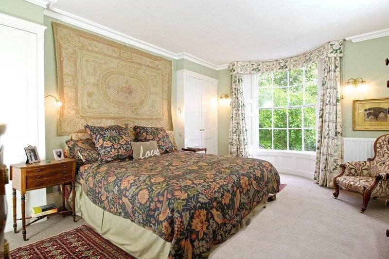The master bedroom includes a rounded bay window