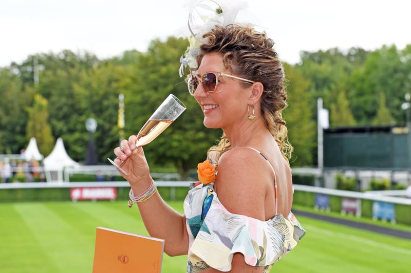 Champagne anyone? Sarah Hicklin from Pagham enjoys Ladies' Day at Glorious Goodwood / Pictures: Malcolm Wells
