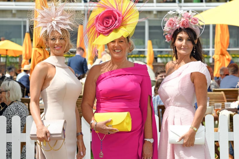 Katie Houghton, Lorna Bruce and the well-known hat designer Ilda Di Vico enjoy Ladies' Day at Glorious Goodwood / Pictures: Malcolm Wells
