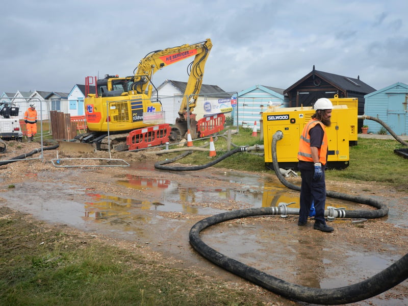Burst sewage main down Cinque Ports Way, Bulverhythe Beach area, St Leonards. SUS-210730-104334001