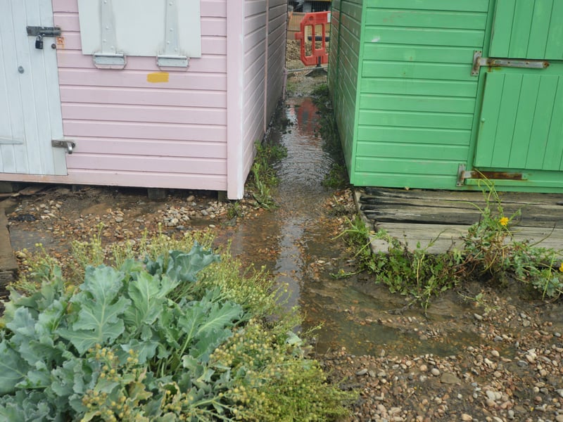 Burst sewage main down Cinque Ports Way, Bulverhythe Beach area, St Leonards. SUS-210730-104724001
