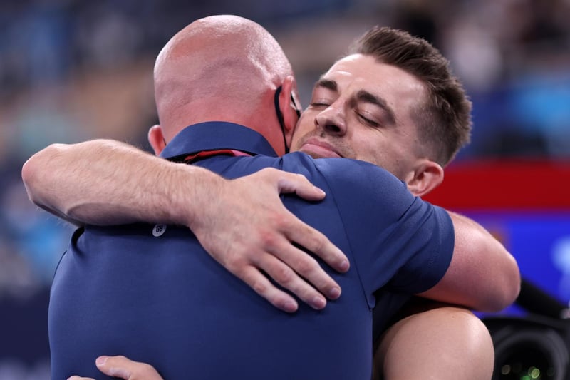 Max Whitlock embraces his coach Scott Hann