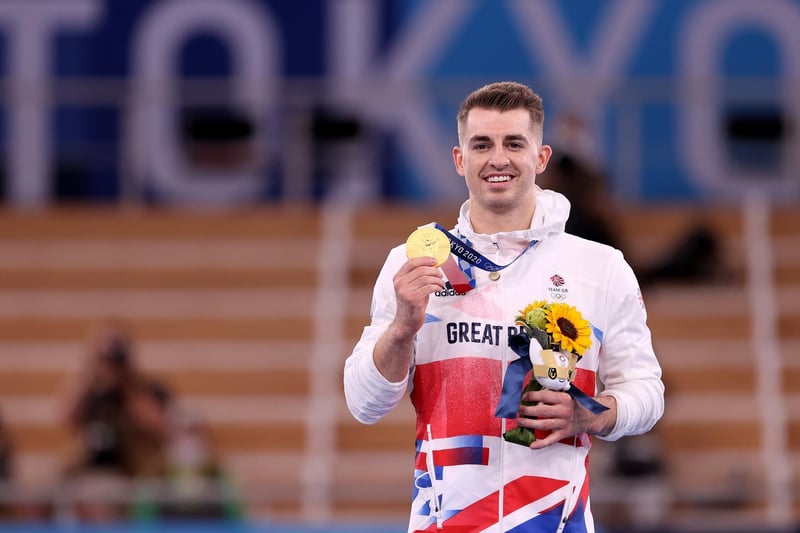 Max Whitlock proudly shows off his third Olympic gold medal