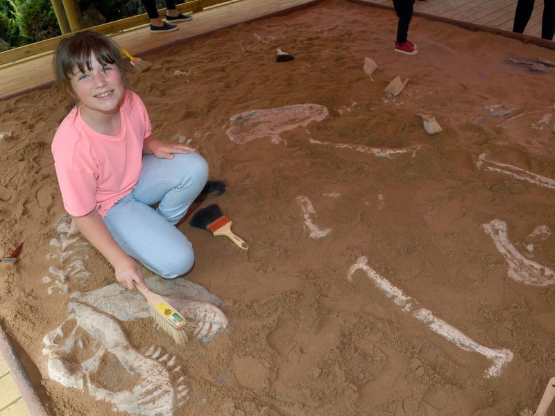 Lily Hart of Orby discovering dinosaur bones in The Dig.
