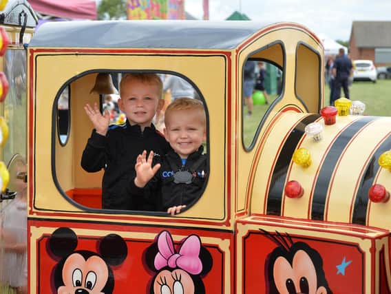 Tommy Lee, 4, and Kingsley Lee, 2, during the Summer Fayre at the Market Harborough Showground.