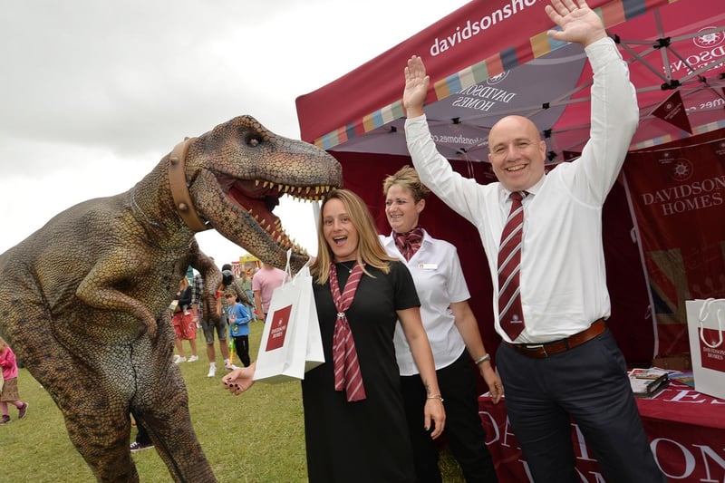A dinosaur visits the Davidson Homes stall during the Summer Fayre at the Market Harborough Showground.