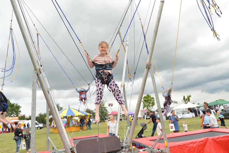 High flier...Hope Axon, 5, during the Summer Fayre at the Market Harborough Showground.