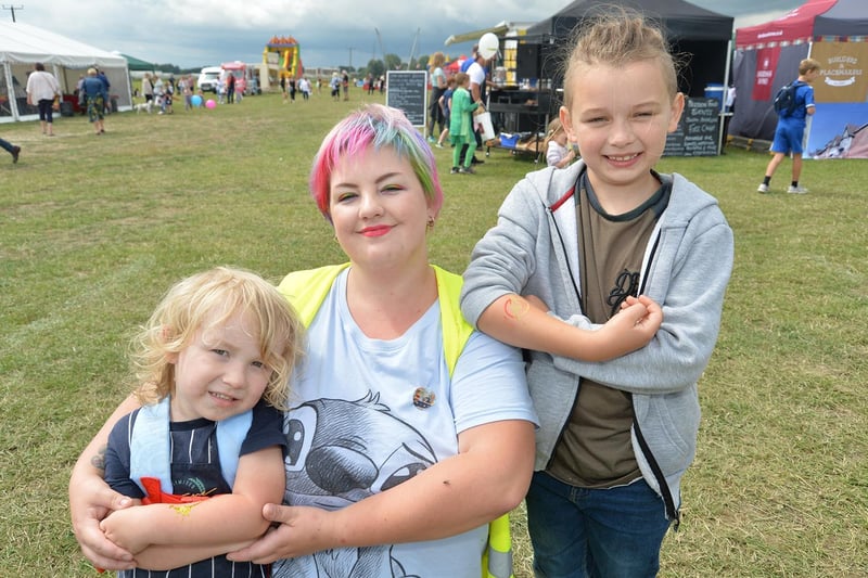 Romeo Coote 3, Charlotte Mawer and Vinnie Coote, 7, during the Summer Fayre at the Market Harborough Showground.