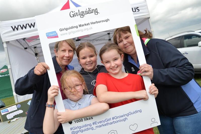 Emma Parr, Evie Pears, 6, Chloe Pears, 10, Izzy Pears, 8, and Hayley Cobbold on the Guide stall during the Summer Fayre at the Market Harborough Showground.