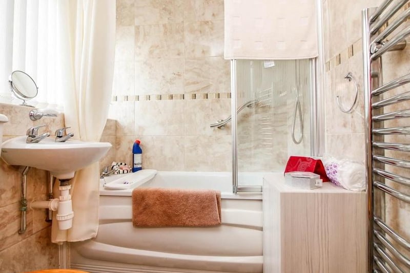 Bathroomhas a window to the front and a suite comprising of bath with a shower over, wash hand basin and low level WC. There is a heated towel rail.