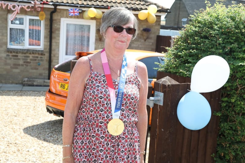 Gran Moira Martin tries the medal on for size