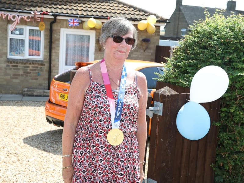 Gran Moira Martin tries the medal on for size