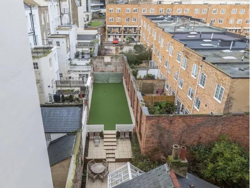 A view of the rear of the property and the Tiger Turf Advantage Pro Astro, ideal for tennis, cricket and as a putting green.
