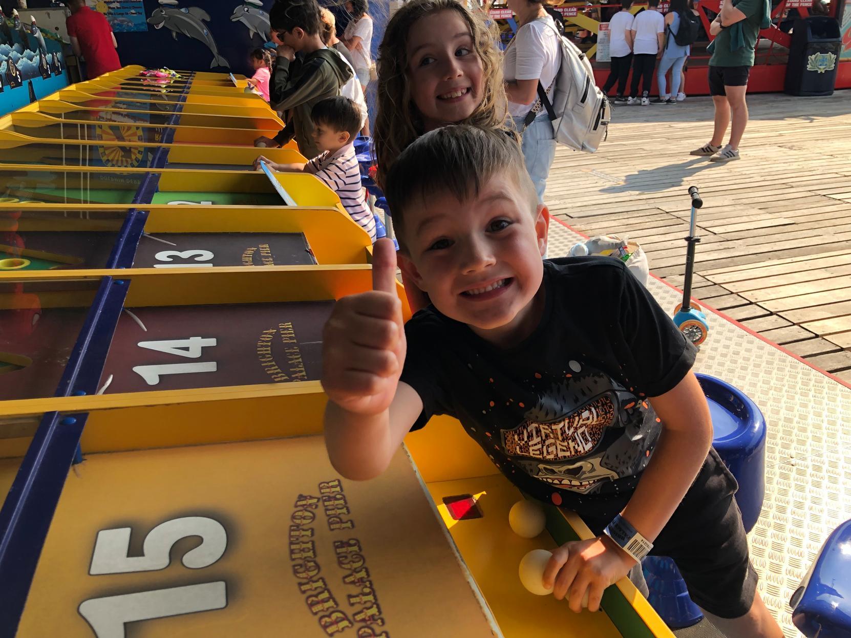 Thumbs up for the dolphin derby on Brighton Palace Pier