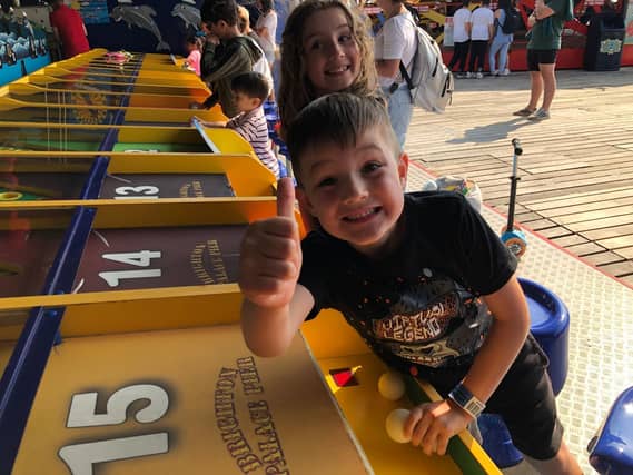 Thumbs up for the dolphin derby on Brighton Palace Pier