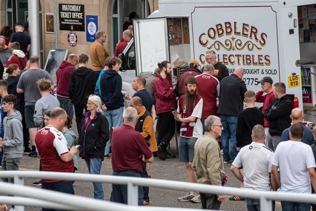 Cobblers fan outside the PTS Academy Stadium on Saturday (August 7). Photo: Louise Smith