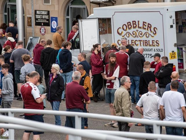 Cobblers fan outside the PTS Academy Stadium on Saturday (August 7). Photo: Louise Smith