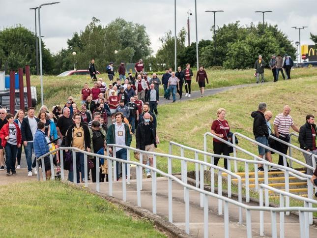 Cobblers fan outside the PTS Academy Stadium on Saturday (August 7). Photo: Louise Smith