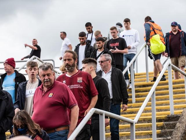 Cobblers fan outside the PTS Academy Stadium on Saturday (August 7). Photo: Louise Smith