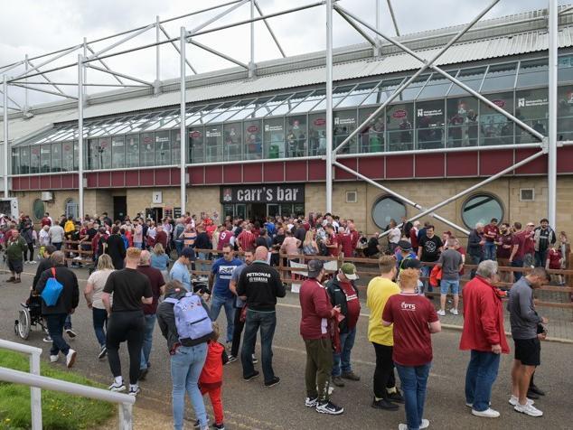 Cobblers fan outside the PTS Academy Stadium on Saturday (August 7). Photo: Louise Smith